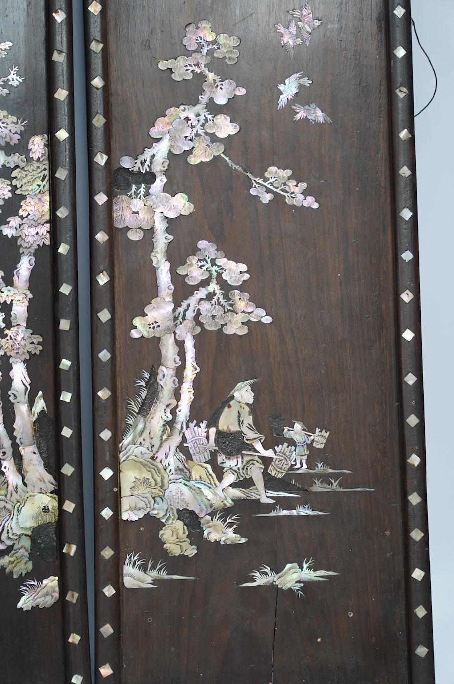 A pair of Chinese mother of pearl inlaid panels, 68 x 20cm. Condition - poor to fair